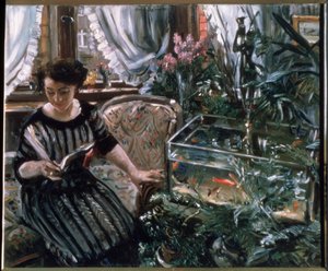 Een vrouw die leest bij een goudvissenkom door Lovis Corinth